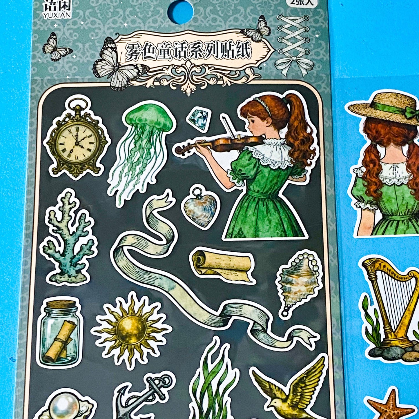 mermaid's secret cove little mermaid matte sticker pack with 2 decorative sheets featuring elegant mermaids, dolphins, whales, jellyfish, turtles, sailing ships, pearls, seashells and vintage ocean inspired illustrations Uk stationery shop.