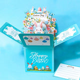 Easter-themed pop-up card with bunnies, eggs, and flowers on a blue background