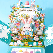 Easter-themed pop-up card with bunnies, eggs, and flowers on a blue background