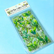pack of 6 sheets clear plastic lily of the valley green and white stickers on a blue background