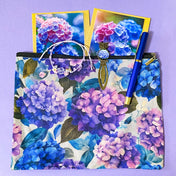 dark floral hydrangea gift set with textured large canvas pouch, owl hydrangea metal bookmark, crystal adjustable bracelet, blue metal pen and floral greetings cards with kraft envelopes. uk cute letterbox gifts shop. 