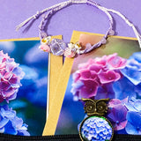 dark floral hydrangea gift set with textured large canvas pouch, owl hydrangea metal bookmark, crystal adjustable bracelet, blue metal pen and floral greetings cards with kraft envelopes. uk cute letterbox gifts shop. 