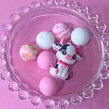 pastel pink silicone bead craft bundles featuring a cute farm black and white cow focal bead or a pink patterned bead with coordinating pink white and floral round silicone beads. uk cute craft supplies shop.