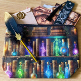 vintage apothecary writing set with feather pen, celestial bookmark, colourful potions pouch on a wooden background