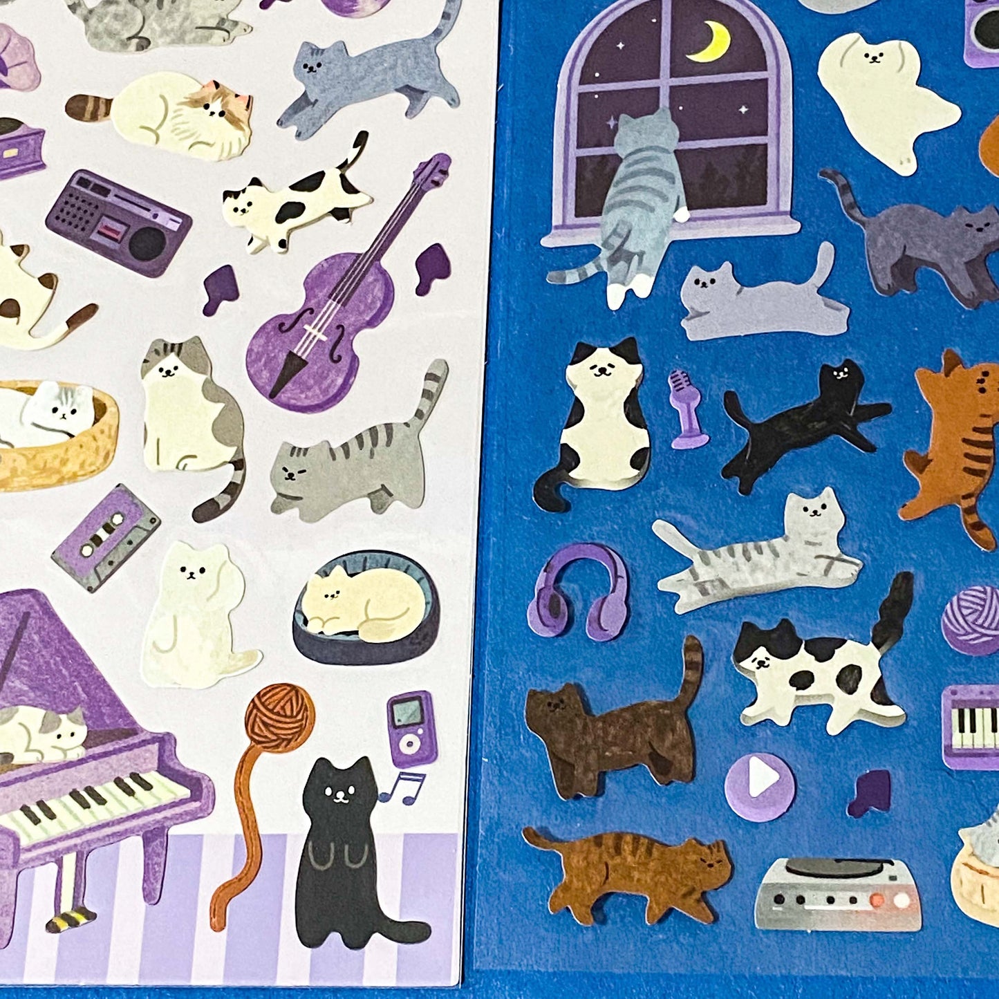 the secret life of cats matte clear sticker PET pack of 2 sheets featuring cosy illustrated cats and home scenes. Choose from the blue sitting room, the moonlit music room or the little cat cafe. UK stationery shop.