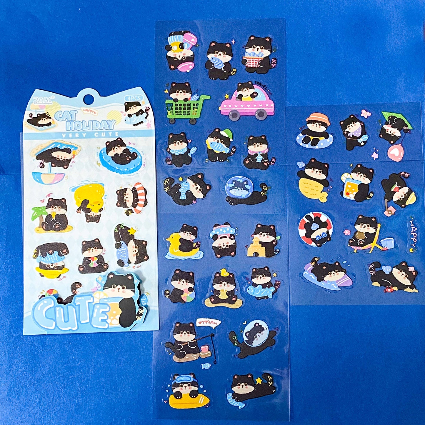 tuxedo black and white cat kawaii cartoon cats matte PET sticker packs of 4 sheets with colourful cute designs including summer holiday, christmas, party and fruits. uk stationery shop.