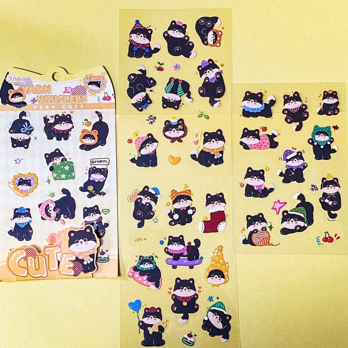 tuxedo black and white cat kawaii cartoon cats matte PET sticker packs of 4 sheets with colourful cute designs including summer holiday, christmas, party and fruits. uk stationery shop.