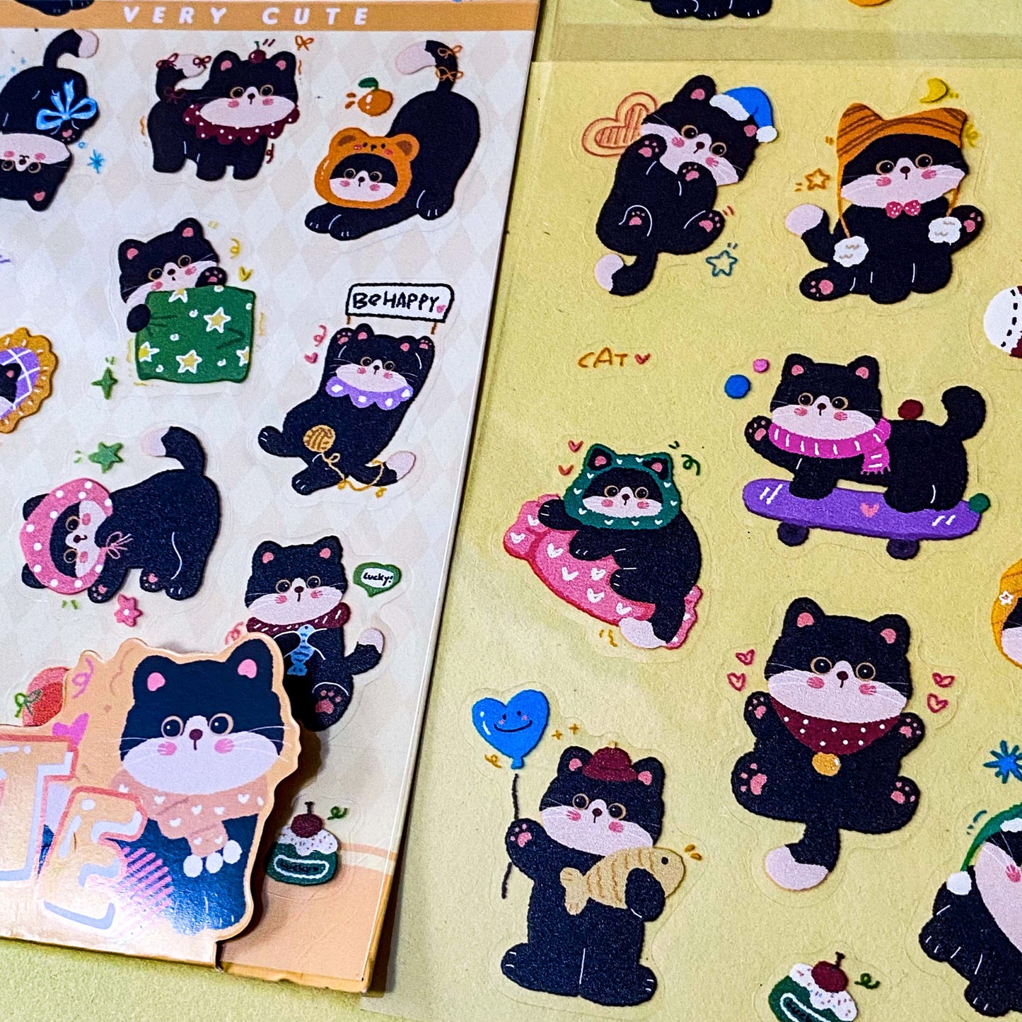 tuxedo black and white cat kawaii cartoon cats matte PET sticker packs of 4 sheets with colourful cute designs including summer holiday, christmas, party and fruits. uk stationery shop.