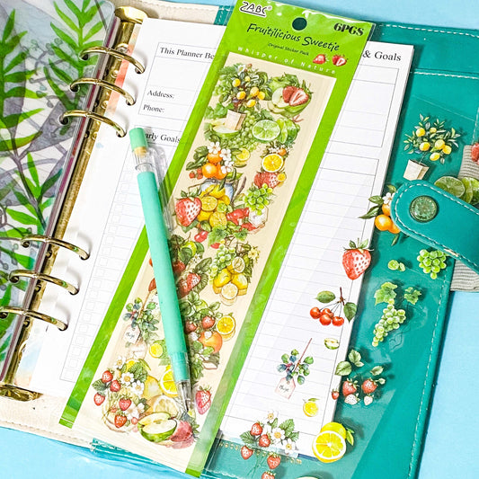 fruits clear planner stickers pack of  sheets on a teal planner on a blue background