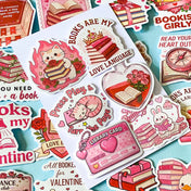 set of 52 stickers, book themed holographic stickers with pink and red designs featuring books, reading, animals , flowers and romantic bookish quotes 