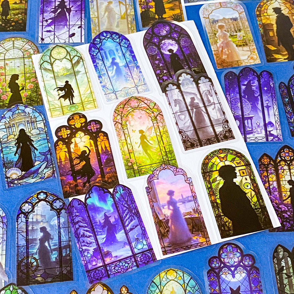 50 different storybook fairytale stained glass window stickers PET clear plastic. Scenes include fairies, witches, mermaids, castles, forests, pirates, enchanted  magical forests and oceans. uk sticker shop gift set.