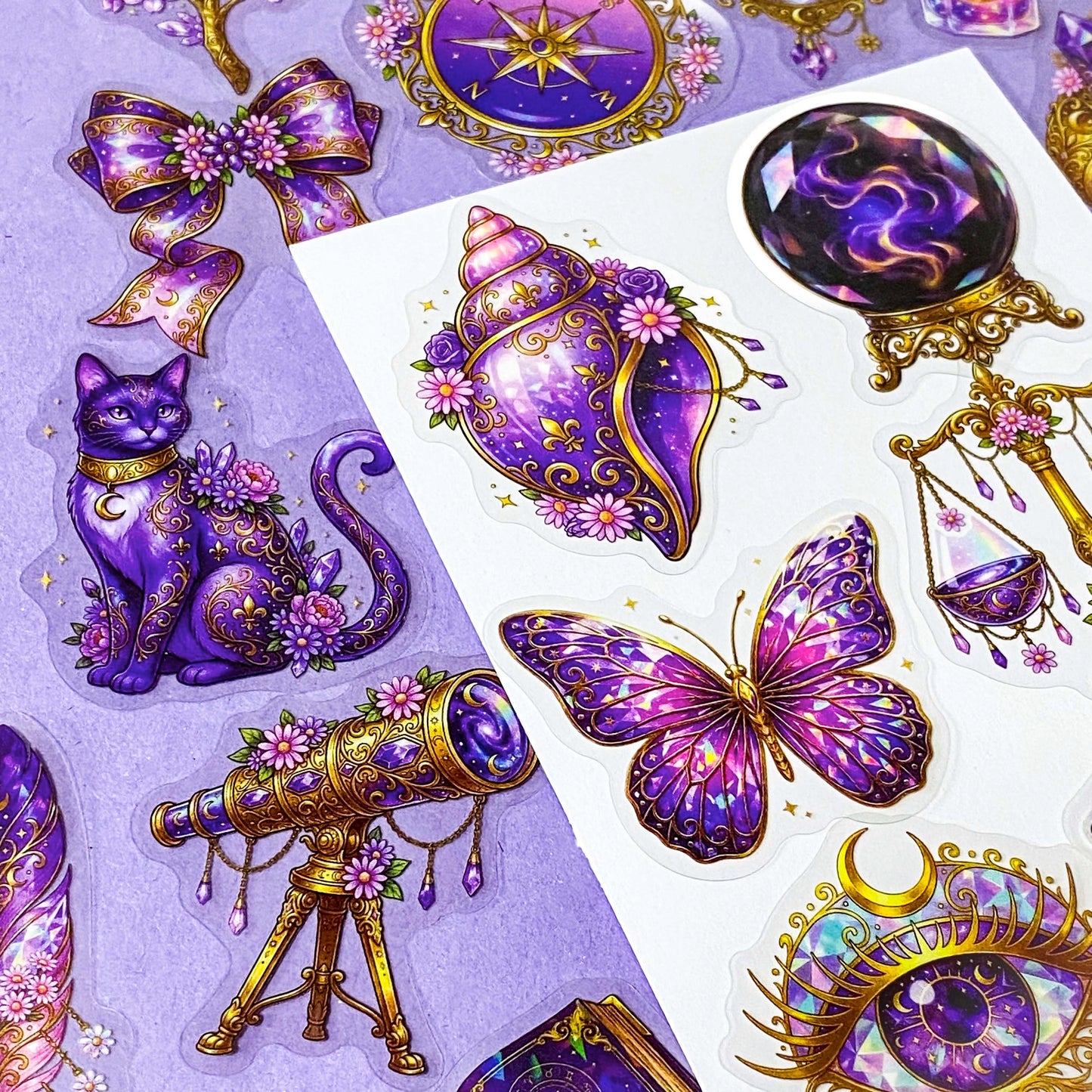 50 different violet oracle witchcore peT stickers featuring crystal balls, tarot cards, butterflies, celestial eyes, candle, skull, moons, potions, flowers, cat, magical purple illustrations. uk stationery gift shop.
