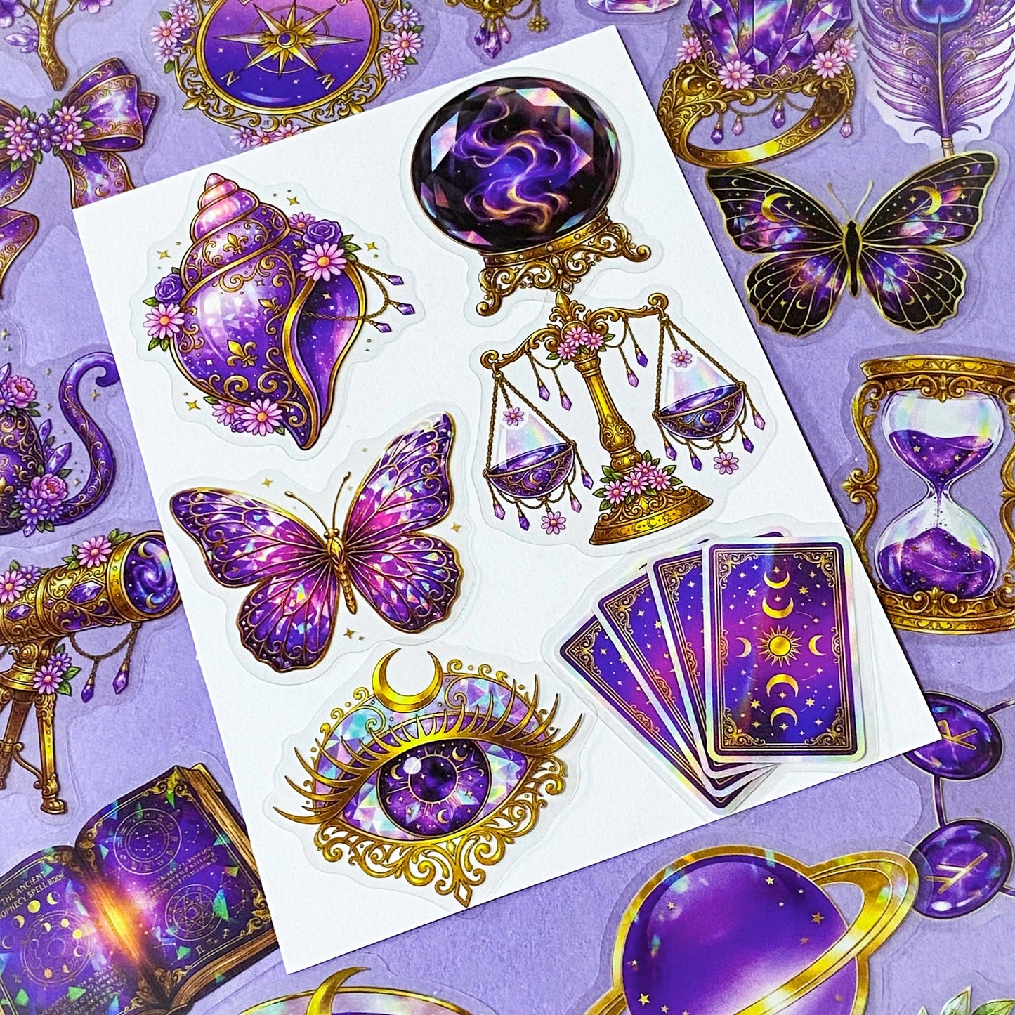 50 different violet oracle witchcore peT stickers featuring crystal balls, tarot cards, butterflies, celestial eyes, moons, potions, flowers, magical purple illustrations. uk stationery gift shop.