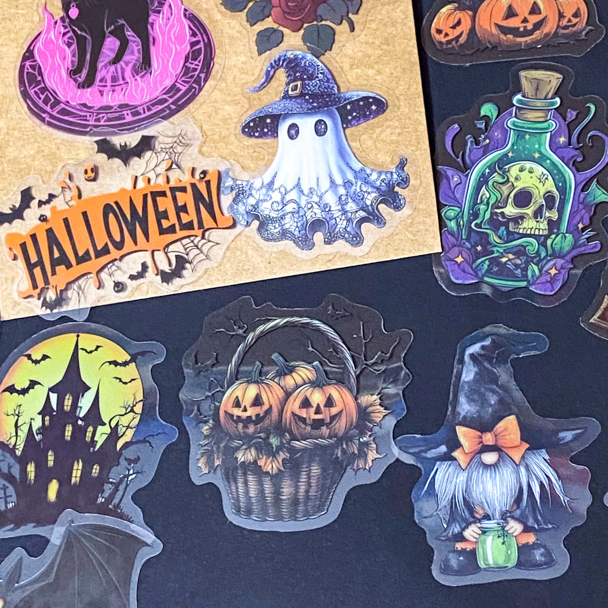 50 different halloween pET STICKERS UP TO 67MM, FEATURING PUMPKINS, GHOSTS, SKELETONS, BLACK CATS, RAVENS, POTIONS, SPOOKY GOTHIC ILLUSTRATIONS. Uk cute stationery gift shop. purple, orange and black.