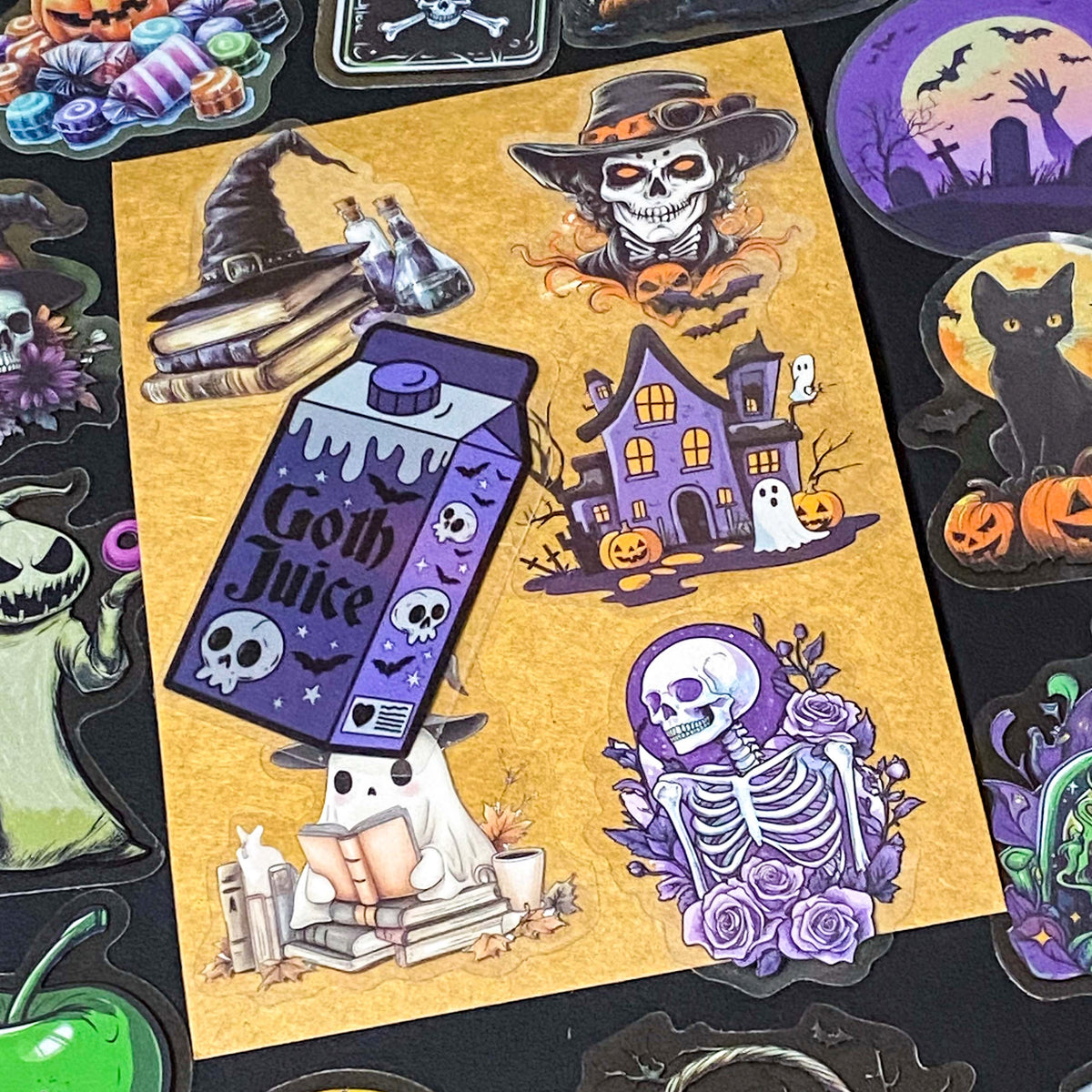 50 different halloween pET STICKERS UP TO 67MM, FEATURING PUMPKINS, GHOSTS, SKELETONS, BLACK CATS, RAVENS, POTIONS, SPOOKY GOTHIC ILLUSTRATIONS. Uk cute stationery gift shop. purple, orange and black.