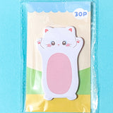 white cat sticky note pad on a blue background
