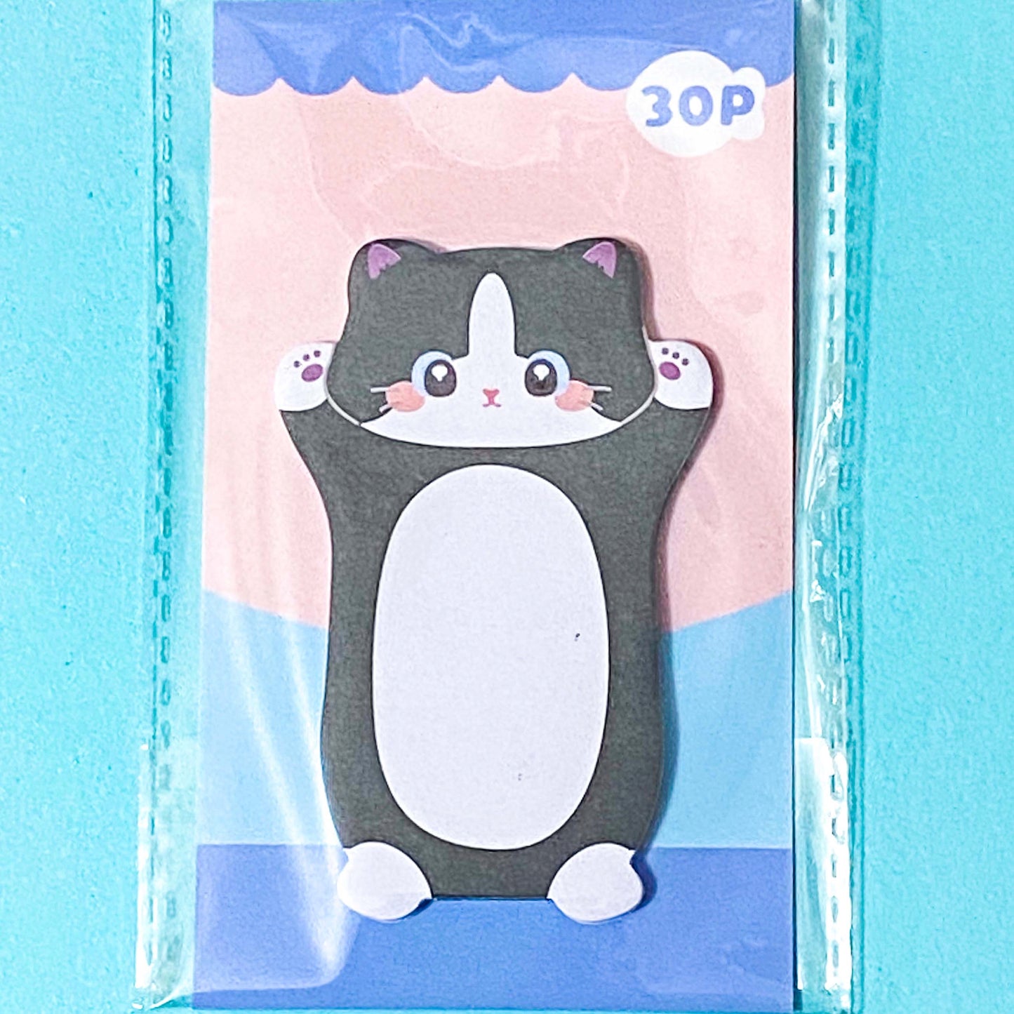black cat sticky note pad on a blue background