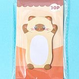 cream and brown siamese cat sticky note pad on a blue background