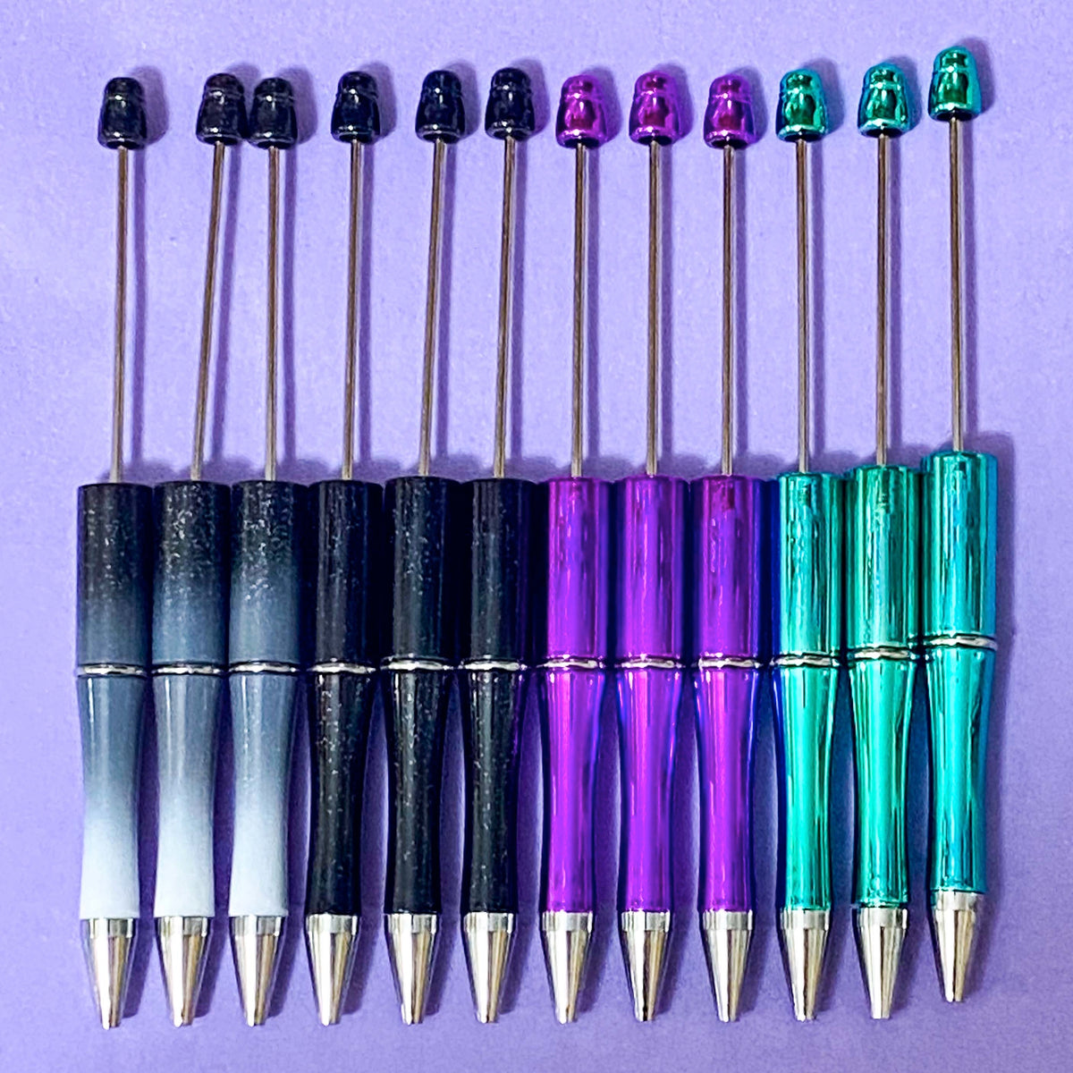 halloween pen base blank for making beaded pens in ombre glitter grey and black, glittery black, foil magenta purple and spooky foiled green turquoise. uk craft shop for autumn projects. black ink with refills.