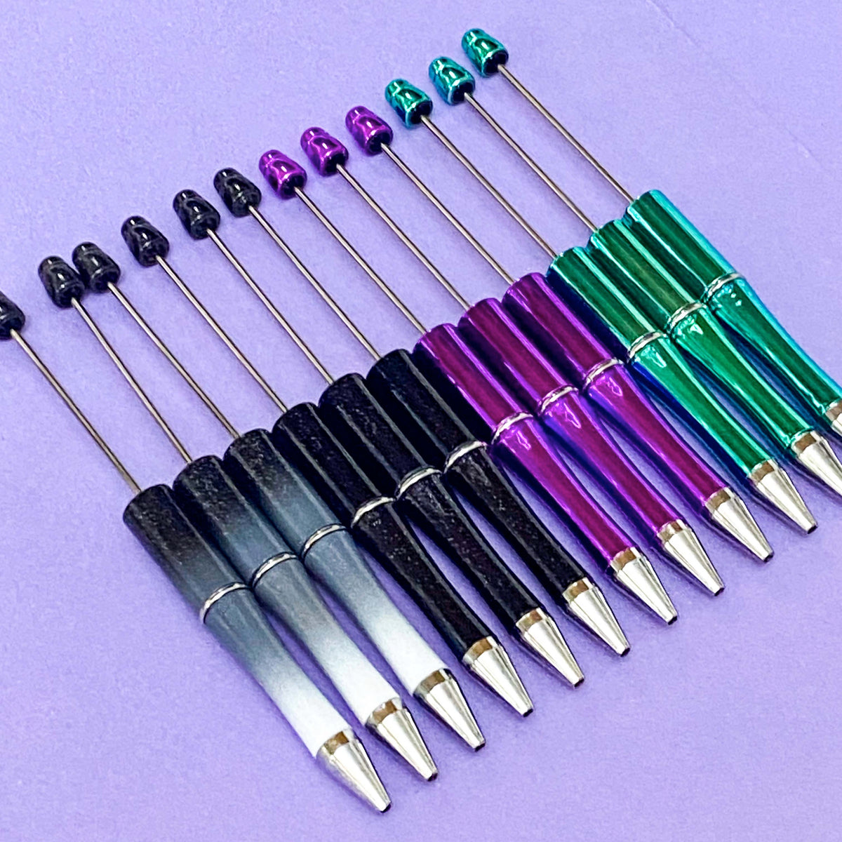 halloween pen base blank for making beaded pens in ombre glitter grey and black, glittery black, foil magenta purple and spooky foiled green turquoise. uk craft shop for autumn projects. black ink with refills.