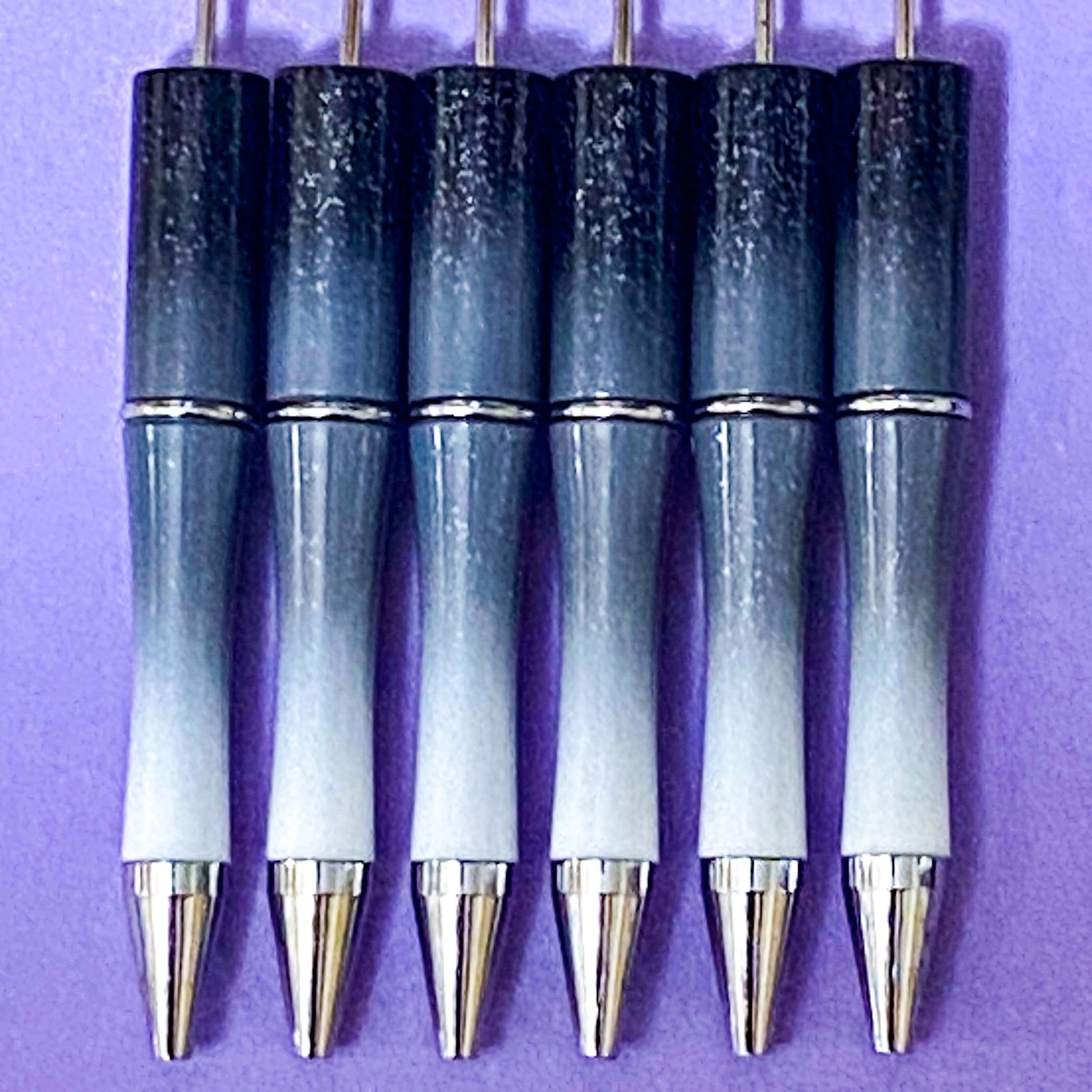 halloween pen base blank for making beaded pens in ombre glitter grey and black, glittery black, foil magenta purple and spooky foiled green turquoise. uk craft shop for autumn projects. black ink with refills.