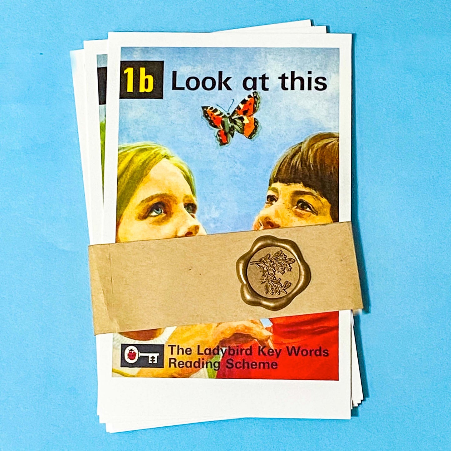 set of 5 ladybird key words reading scheme postcards packaged with a kraft band and a wax sticker seal