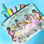 Pouch with cat-themed tea party design on a blue background