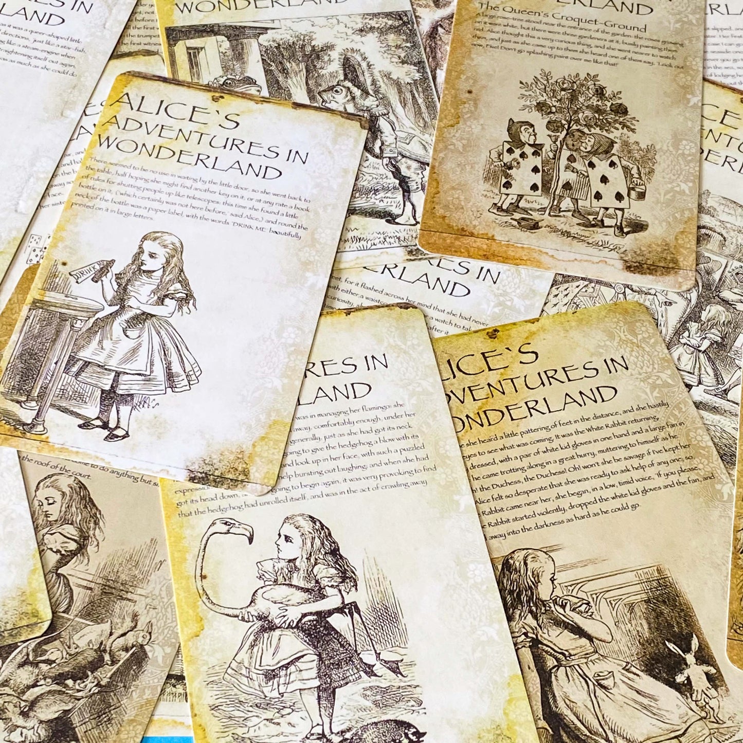 vintage alice in wonderland postcard set with aged sepia parchment illustrations, kraft belly band and wax seal presentation making a beautiful uk letterbox gift