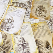 vintage alice in wonderland postcard set with aged sepia parchment illustrations, kraft belly band and wax seal presentation making a beautiful uk letterbox gift