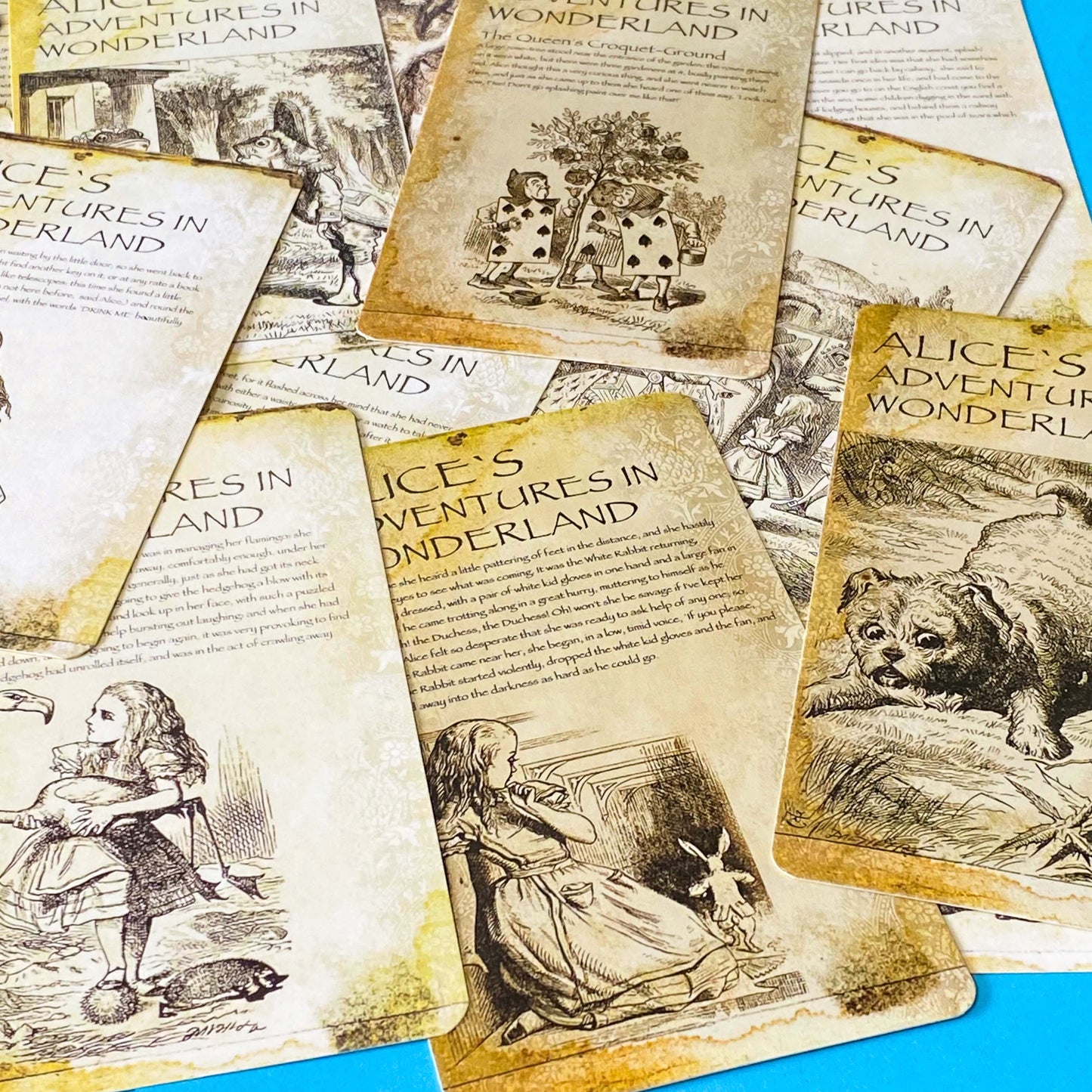 vintage alice in wonderland postcard set with aged sepia parchment illustrations, kraft belly band and wax seal presentation making a beautiful uk letterbox gift