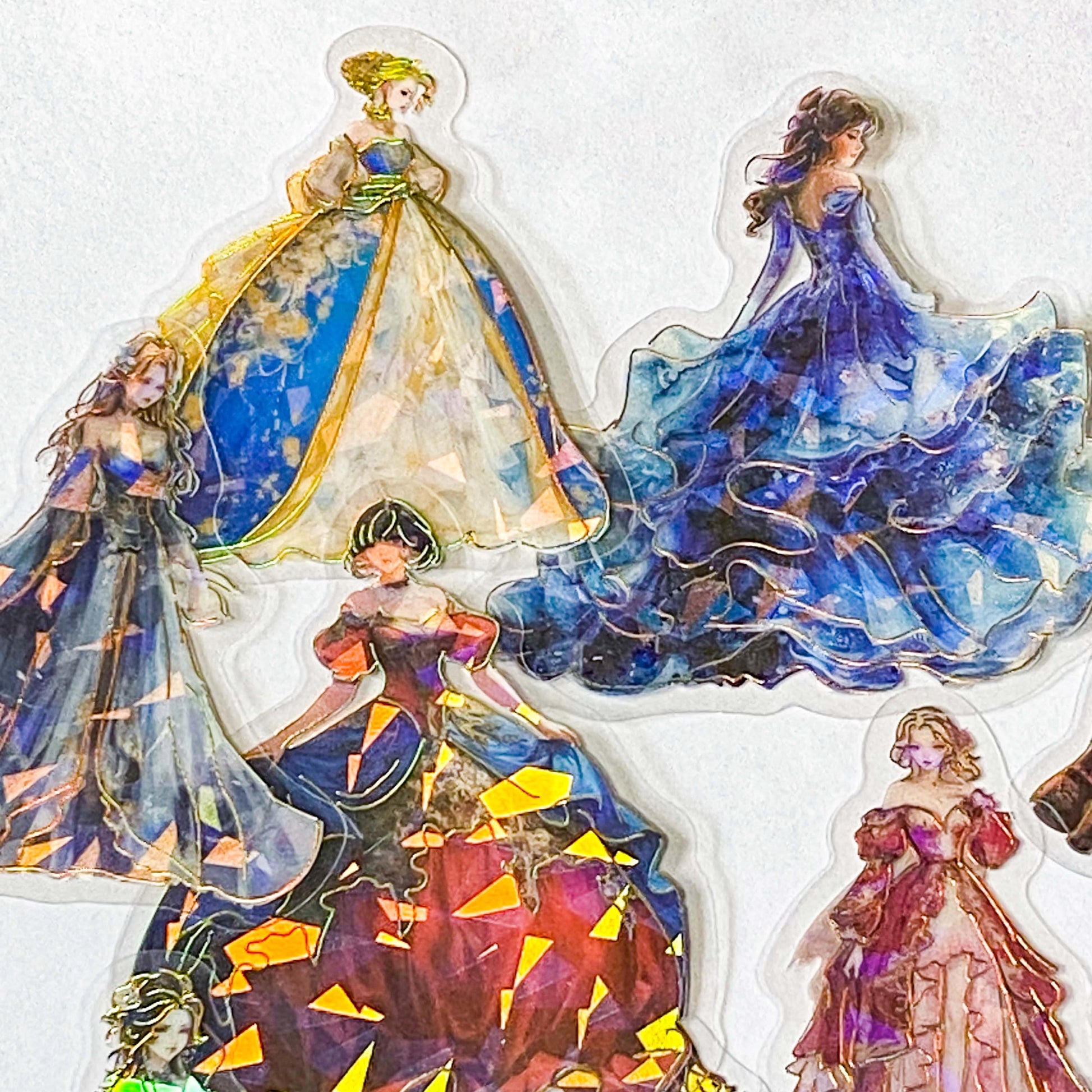 pack of 30 holographic princess stickers with gold foil outlines featuring elegant dancing princesses, castle scenes and fantasy ball gowns on transparent pet plastic clear material. uk cute stationery shop. storybook sticker set.