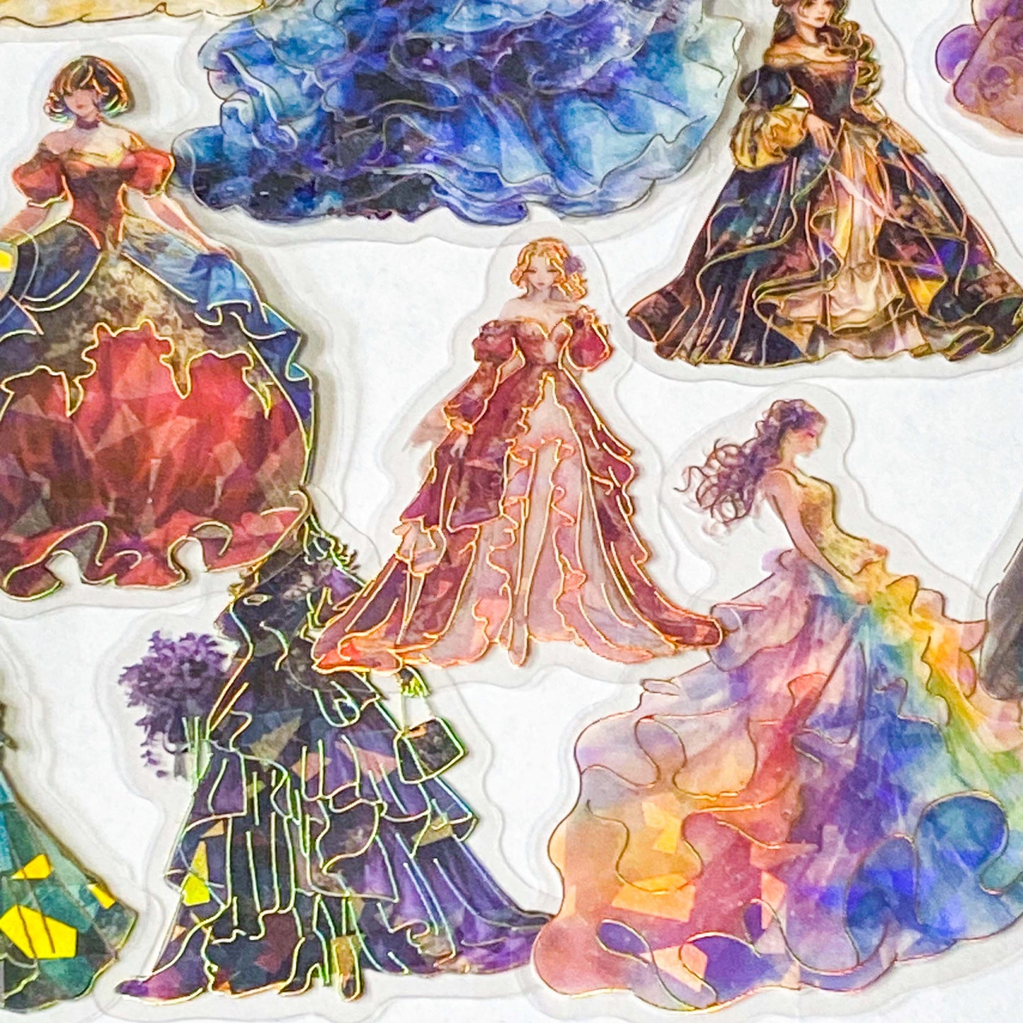 pack of 30 holographic princess stickers with gold foil outlines featuring elegant dancing princesses, castle scenes and fantasy ball gowns on transparent pet plastic clear material. uk cute stationery shop. storybook sticker set.