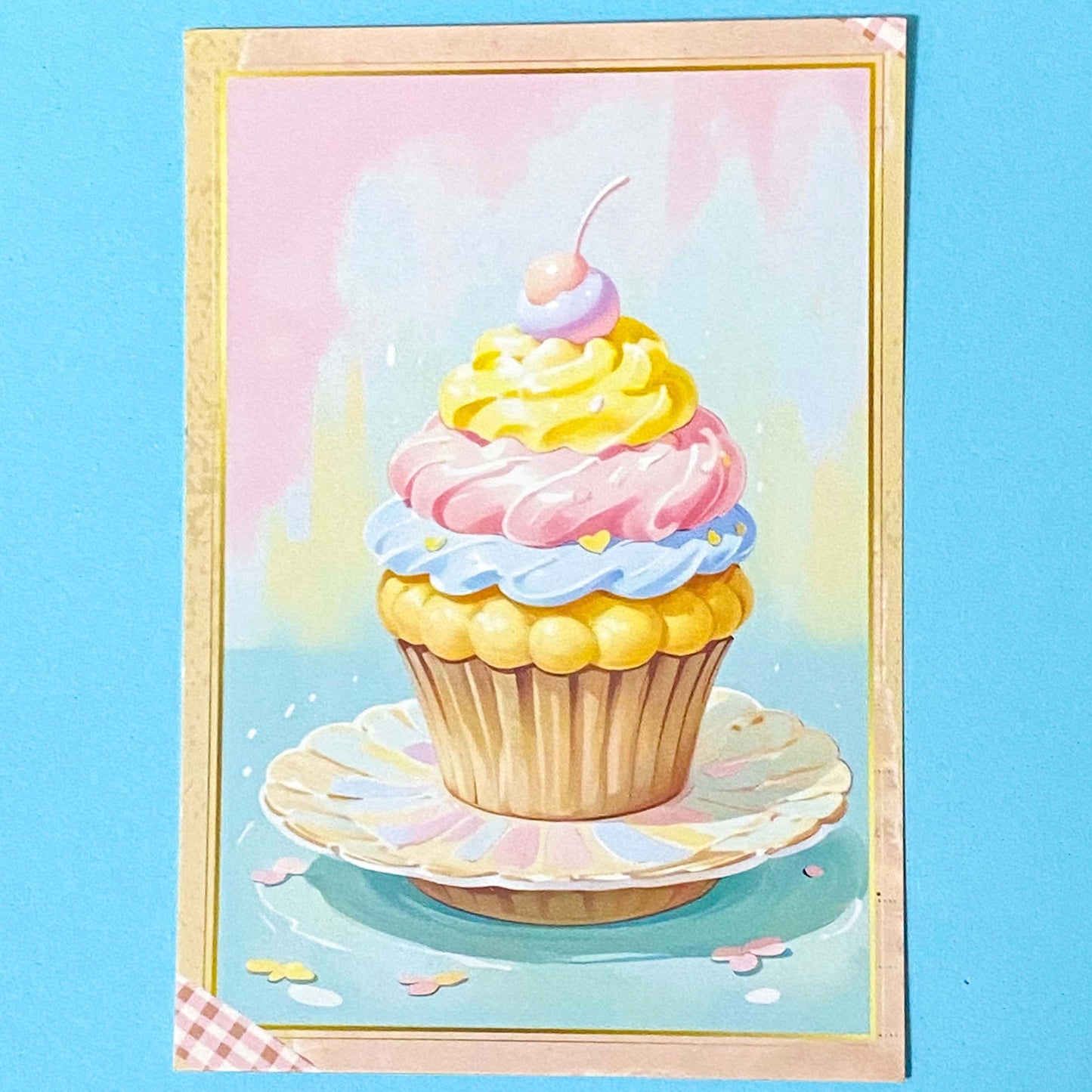 Colorful cupcake postcard on a blue background