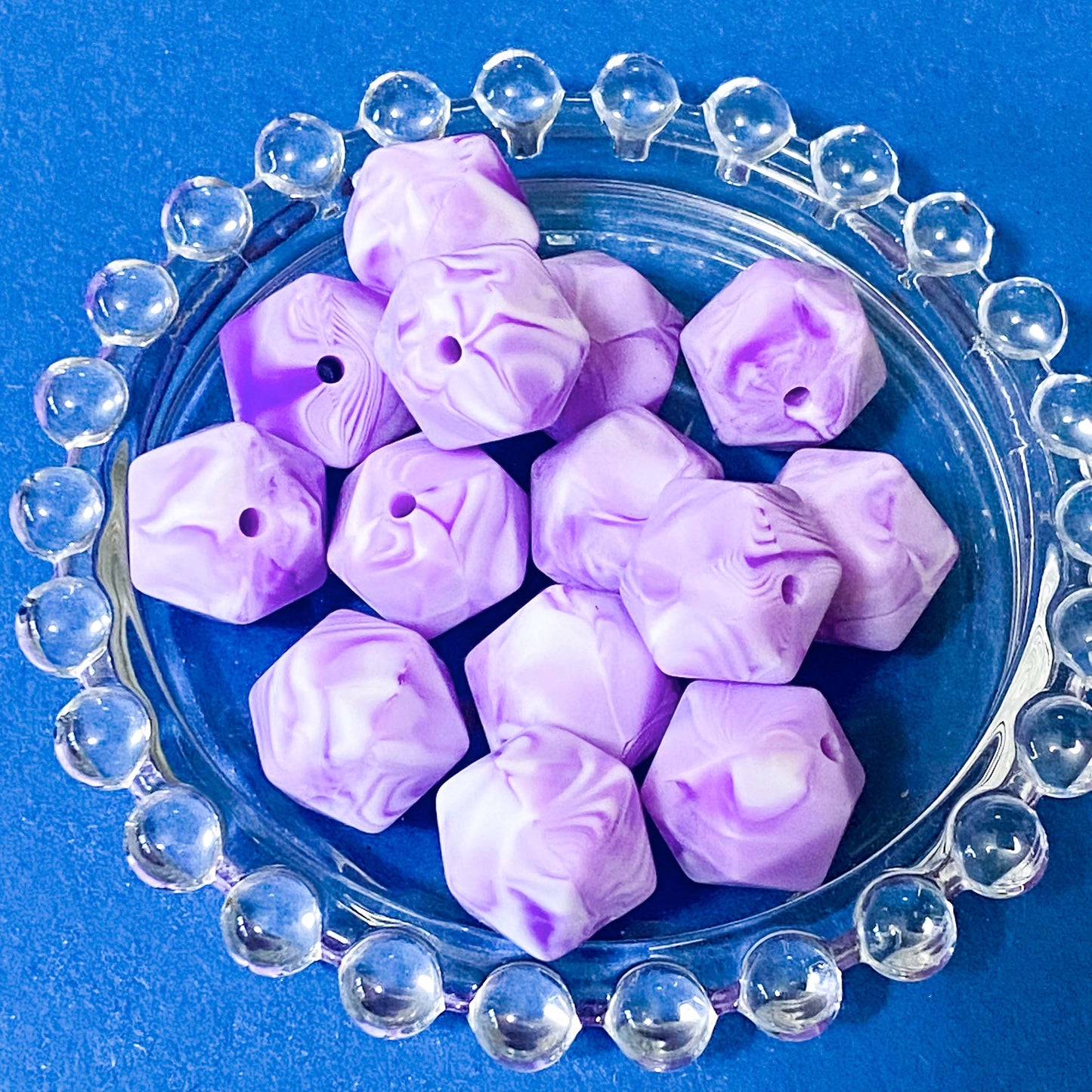 20mm multi sided hexagonal silicone beads with 2mm hole. Dodecagon bead with purple and lilac marbled pattern with white. uk craft supplies shop.