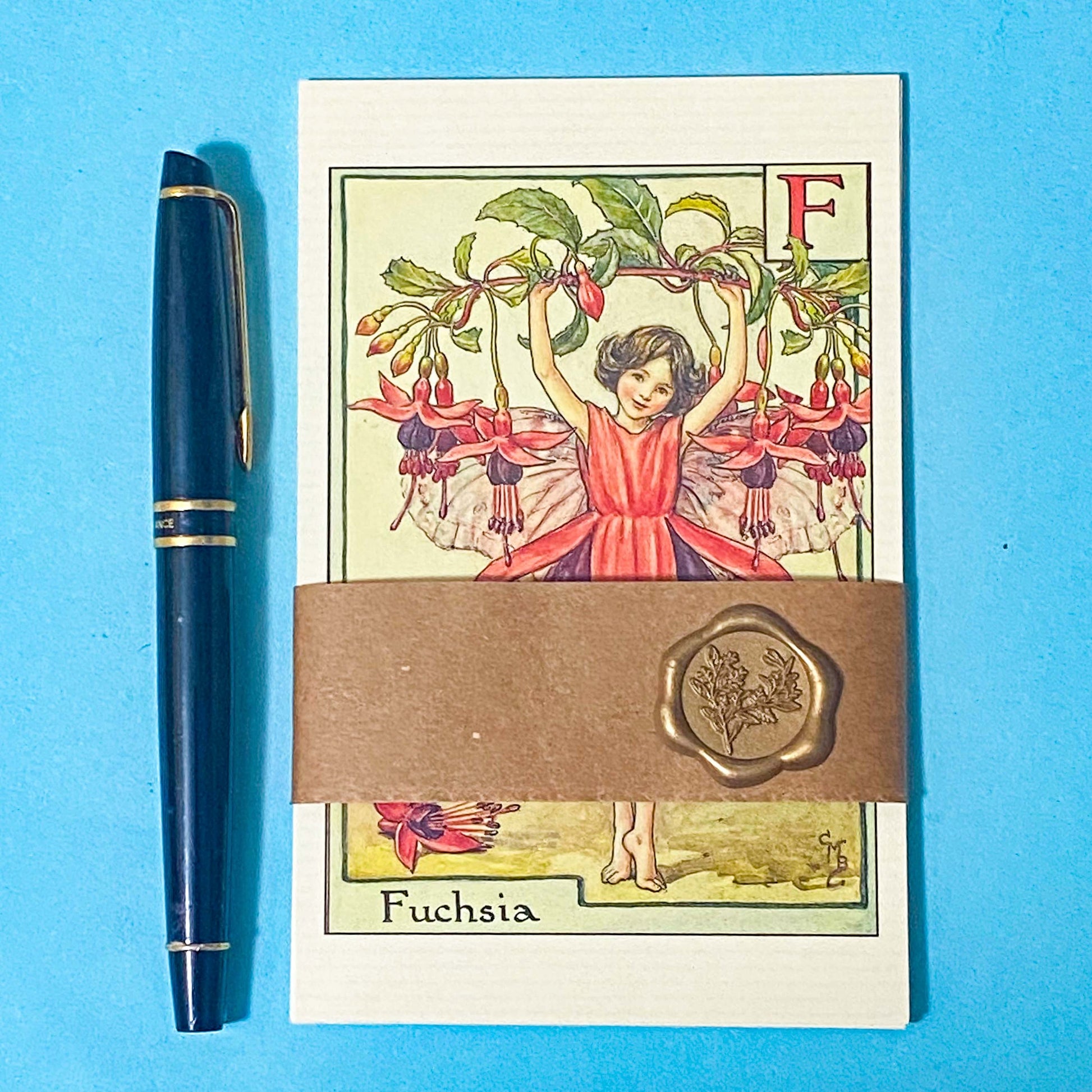 pack of 5 vintage flower fairy postcards wrapped in a belly band with a wax seal featuring letters of the alphabet f, g, h, i and j