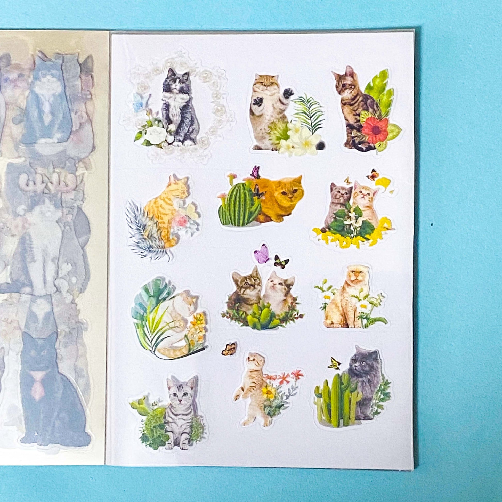 cat elf sticker book of 20 clear sheets of vintage cats and flowers pet stickers on a blue background