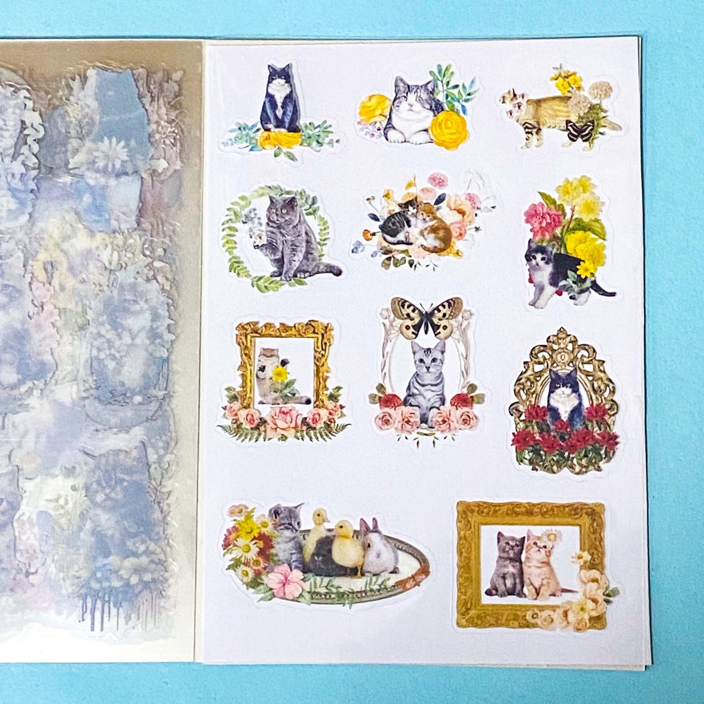 cat elf sticker book of 20 clear sheets of vintage cats and flowers pet stickers on a blue background