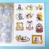 cat elf sticker book of 20 clear sheets of vintage cats and flowers pet stickers on a blue background