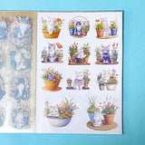 cat elf sticker book of 20 clear sheets of vintage cats and flowers pet stickers on a blue background