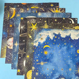 celestial scrapbook paper pack with dark blue sky night designs featuring gold stars, moons, planets and vintage astrology illustrations