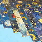 celestial scrapbook paper pack with dark blue sky night designs featuring gold stars, moons, planets and vintage astrology illustrations
