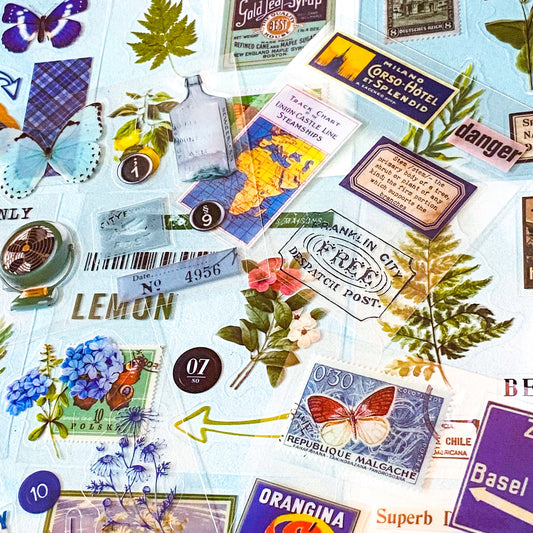 pack of 25 clear sticker sheets in blue and green theme featuring vintage butterflies, postage stamps, flowers, plants and retro packaging of products labels