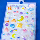 close up of 3d domed plastic stickers with bears, moon, stars, clouds and animals