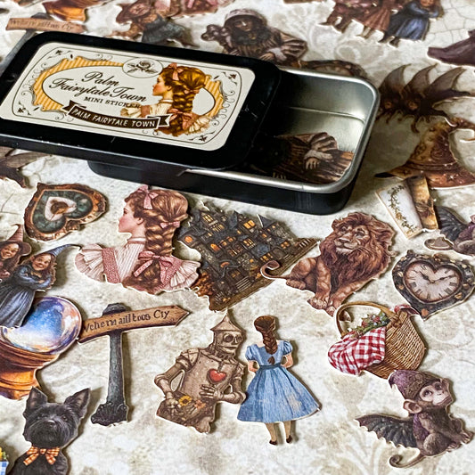 wizard of Oz card stickers in a mini tin featuring vintage style illustrations of dorothy, the lion, tin man and witch