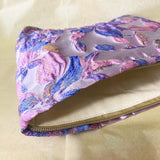 lavender, pink and gold satin tapestry pouch with woven floral design, cream lining, concealed zip and structured gusset base. Pastel large cosmetic bag or jewellery pouch. Journaling storage or travel essentials case. Uk gift shop for letterbox gifts.
