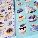 2 clear PET sticker sheets in a blueberry treats theme with grey tabby cats and decorative food and drink stickers with a blue theme. Uk cute stationery shop.