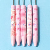 pink pen blanks with bows pattern on blue background