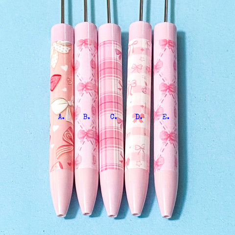 pink pen blanks with bows pattern on blue background