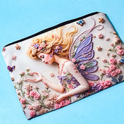 fairy garden canvas zip pouch with floral illustration and butterfly wings used as a pencil case on a blue background