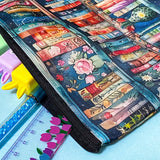 book lover pencil case with illustrated library shelves and zip closure on a blue background